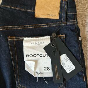 Rag and bone boot, cut jeans, dark color